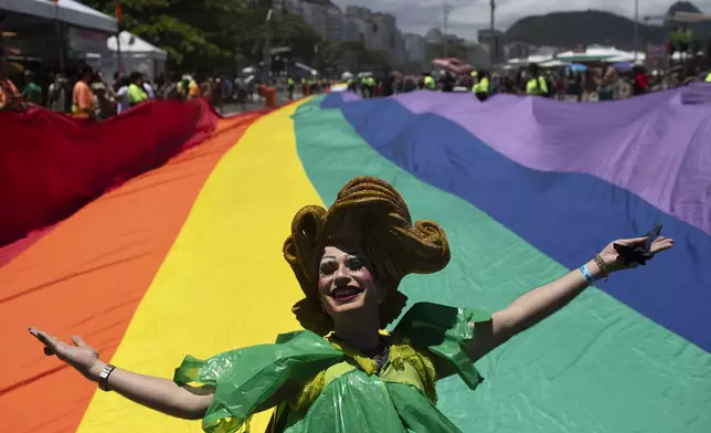 A performer poses for a photo during the 29th LGBTI+ Rio Pride Parade along Copacabana beach in Rio de Janeiro, Sunday, Nov. 24, 2024. (AP Photo/Bruna Prado)