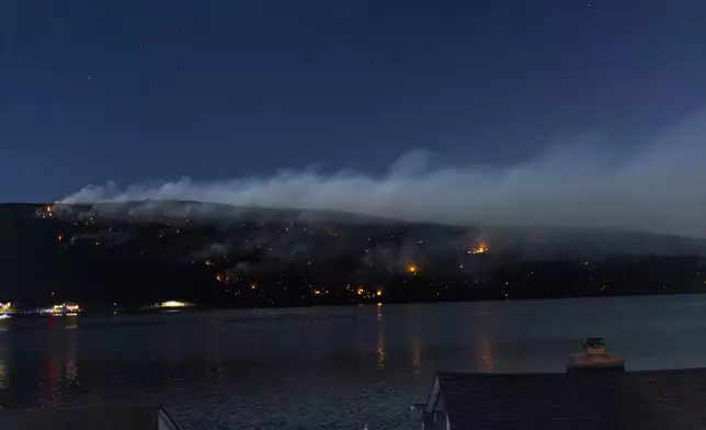 Wildfires burn along the New York and New Jersey border in Greenwood Lake, New York, Wednesday, Nov. 13, 2024. (AP Photo/Eduardo Munoz Alvarez)