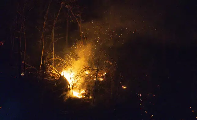 Wildfires burn along the New York and New Jersey border in Greenwood Lake, New York, Wednesday, Nov. 13, 2024. (AP Photo/Eduardo Munoz Alvarez)