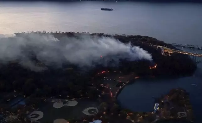 This aerial image taken from video shows a brush fire that broke out in a park on the northern tip of Manhattan in Inwood, N.Y., Wednesday, Nov. 13, 2024. (WABC-TV via AP)