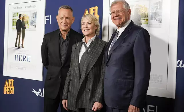 Tom Hanks, from left, Robin Wright, and Robert Zemeckis arrive at the AFI Fest premiere of "Here" on Friday, Oct. 25, 2024, at TCL Chinese Theatre in Los Angeles. (AP Photo/Chris Pizzello)