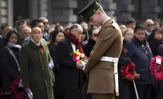 A soldier from Number 9 Company Irish Guards stands at The Cenotaph during the annual Service of Remembrance on Armistice Day in London, Monday, Nov. 11, 2024. (AP Photo/Kirsty Wigglesworth)