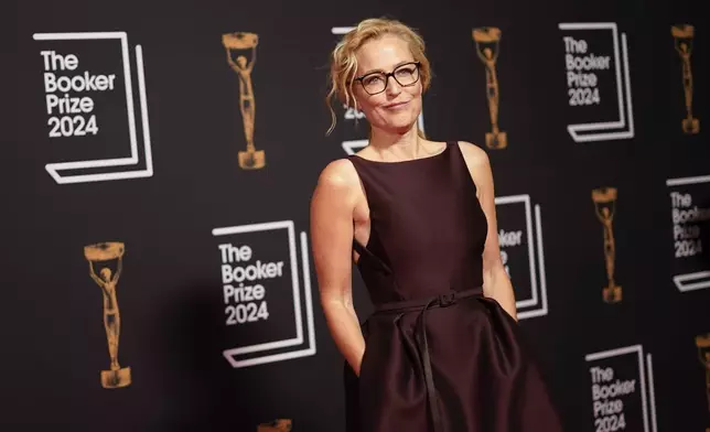 Gillian Anderson arrives at the Booker Prize award dinner in London, Tuesday, Nov. 12, 2024. (AP Photo/Alberto Pezzali)