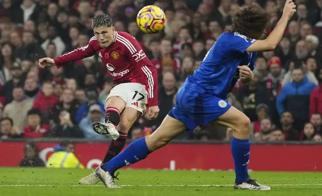 Manchester United's Alejandro Garnacho scores his side's third goal during the English Premier League soccer match between Manchester United and Leicester City, at the Old Trafford stadium in Manchester, England, Sunday, Nov.10, 2024. (AP Photo/Jon Super)