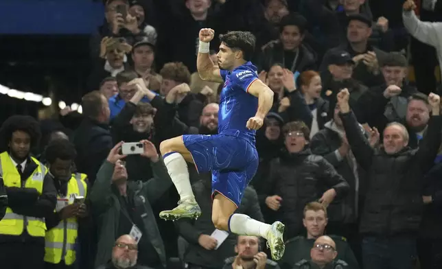 Chelsea's Pedro Neto celebrates after scoring his side's first goal during the English Premier League soccer match between Chelsea and Arsenal at Stamford Bridge stadium in London, Sunday, Nov. 10, 2021. (AP Photo/Kirsty Wigglesworth)