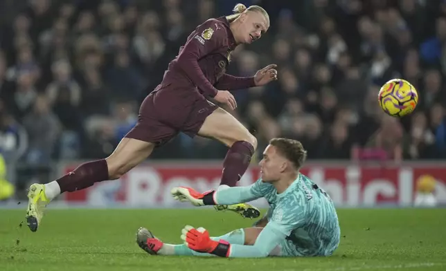 Manchester City's Erling Haaland scores during the English Premier League soccer match between Brighton and Manchester City at Falmer Stadium in Brighton, England, Saturday, Nov. 9, 2024. (AP Photo/Alastair Grant)