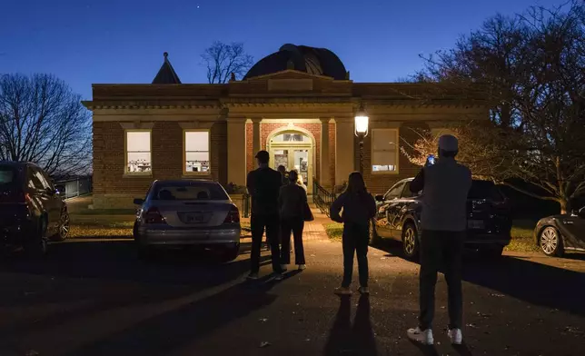 Voters line up to enter their polling place at the Cincinnati Observatory on election day, Tuesday, Nov. 5, 2024, in Cincinnati. (AP Photo/Carolyn Kaster)