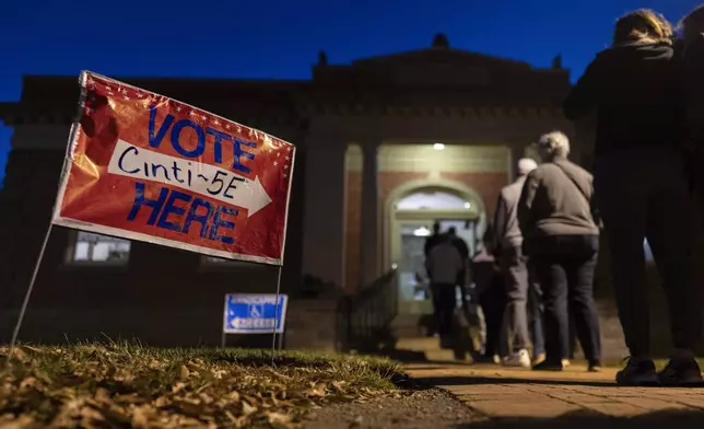 Voters line up to enter their polling place at the Cincinnati Observatory on election day, Tuesday, Nov. 5, 2024, in Cincinnati. (AP Photo/Carolyn Kaster)