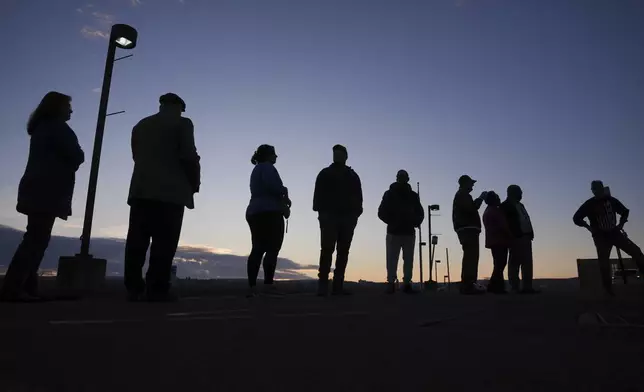 Voters wait in line to cast their ballots at Scranton High School in Scranton, Pa., on Election Day, Tuesday, Nov. 5, 2024. (AP Photo/Matt Rourke)