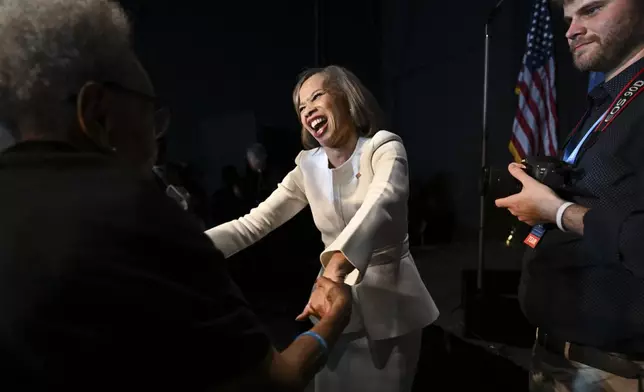 Democratic Delaware Senate candidate state Rep. Lisa Blunt Rochester shakes hands with supporters during an election night watch party Tuesday, Nov. 5, 2024, in Wilmington, Del. (AP Photo/Gail Burton)