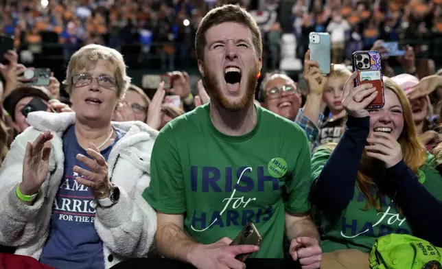 Supporters react as Democratic presidential nominee Vice President Kamala Harris speaks during a campaign rally at Jenison Field House on the campus of Michigan State University, Sunday, Nov. 3, 2024, in East Lansing, Mich. (AP Photo/Jacquelyn Martin)