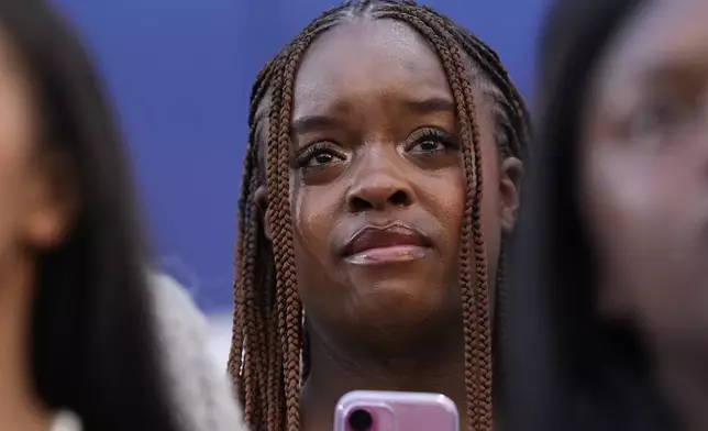 A supporter looks on as Vice President Kamala Harris delivers a concession speech for the 2024 presidential election, Wednesday, Nov. 6, 2024, on the campus of Howard University in Washington. (AP Photo/Susan Walsh)