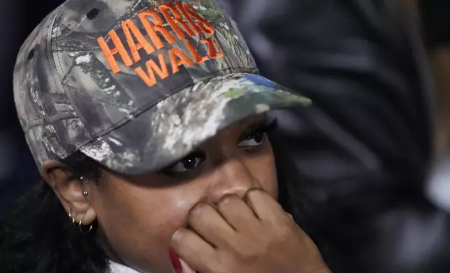 A supporter waiting during an election night campaign watch party for Democratic presidential nominee Vice President Kamala Harris on Tuesday, Nov. 5, 2024, on the campus of Howard University in Washington. (AP Photo/Ben Curtis)