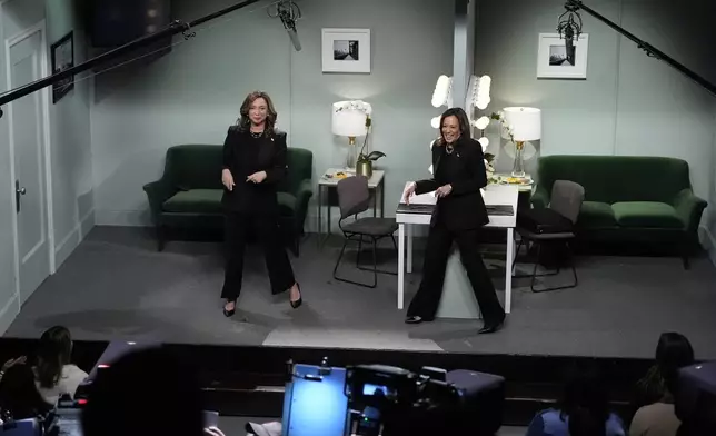 Democratic presidential nominee Vice President Kamala Harris, right, appears on NBC's "Saturday Night Live," with Maya Rudolph, left, Saturday, Nov. 2, 2024 in New York. Harris has made an unannounced trip to New York to appear briefly stepping away from the battleground states she's been campaigning in with just three days to go before the election. (AP Photo/Jacquelyn Martin)