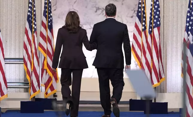 Second gentleman Doug Emhoff, right, walks with Vice President Kamala Harris as she departs after delivering a concession speech for the 2024 presidential election on the campus of Howard University in Washington, Wednesday, Nov. 6, 2024. (AP Photo/J. Scott Applewhite)