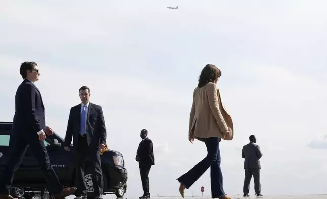 Democratic presidential nominee Vice President Kamala Harris walks to board Air Force Two at Hartsfield Jackson International Airport in Atlanta, Saturday, Nov. 2, 2024, en route to Charlotte, N.C.. (AP Photo/Jacquelyn Martin)