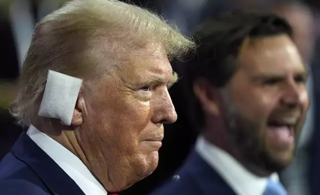 Republican presidential candidate former President Donald Trump and Republican vice presidential candidate Sen. JD Vance, R-Ohio, attend the first day of the Republican National Convention, Monday, July 15, 2024, in Milwaukee. (AP Photo/Evan Vucci)