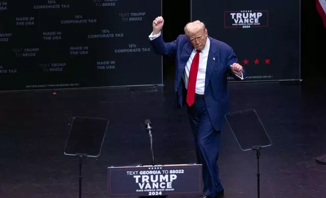 Republican presidential nominee former President Donald Trump dances after speaking at a campaign event Tuesday, Sept. 24, 2024, in Savannah, Ga. (AP Photo/John Bazemore)