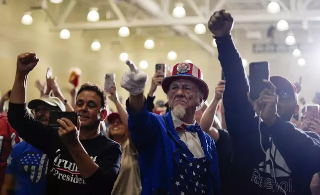 Supporters cheer as Republican presidential nominee former President Donald Trump speaks during a campaign event, Sunday, Sept. 29, 2024, in Erie, Pa. (AP Photo/Matt Rourke)