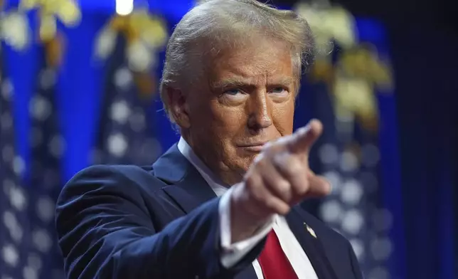 Republican presidential nominee former President Donald Trump arrives at an election night watch party at the Palm Beach Convention Center, Wednesday, Nov. 6, 2024, in West Palm Beach, Fla. (AP Photo/Evan Vucci)