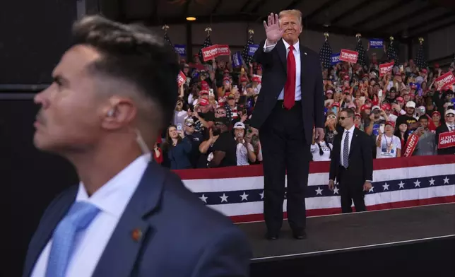 Republican presidential nominee former President Donald Trump waves at a campaign rally at Gastonia Municipal Airport, Saturday, Nov. 2, 2024, in Gastonia, N.C. (AP Photo/Evan Vucci)