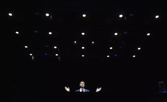 Republican vice presidential nominee Sen. JD Vance, R-Ohio speaks at during a campaign rally at FIM Capitol Theatre, Monday, Nov. 4, 2024, in Flint, Mich. (AP Photo/Paul Sancya)