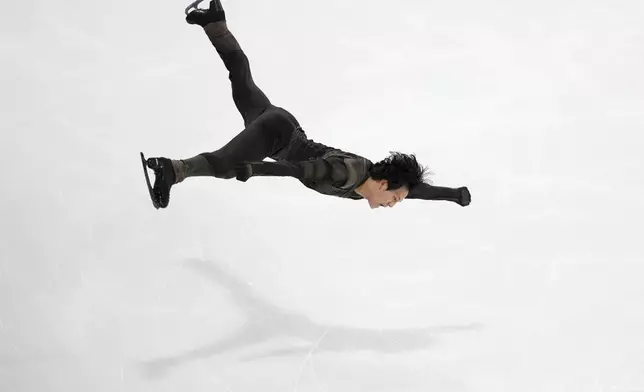 Adam Siao Him Fa, of France, competes in the men's free skating segment at the ISU Grand Prix of Figure Skating, Saturday, Nov. 2, 2024, in Angers, France. (AP Photo/Aurelien Morissard)