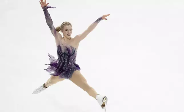 Amber Glenn, of the United States, competes in the women's free skating segment at the ISU Grand Prix of Figure Skating, Saturday, Nov. 2, 2024, in Angers, France. (AP Photo/Aurelien Morissard)