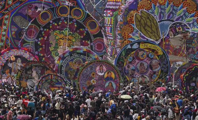 Kites are displayed for All Saints Day in Sumpango, Guatemala, Friday, Nov. 1, 2024, as part of Day of the Dead celebrations. (AP Photo/Matias Delacroix)