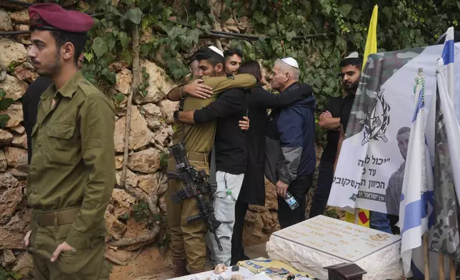 Mourners attend the funeral of Israeli soldier Orr Katz, who was killed in a battle in the Gaza Strip, at the Mount Herzl military cemetery in Jerusalem, Tuesday, Nov. 12, 2024. (AP Photo/Ohad Zwigenberg)