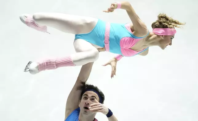 Anastasiia Metelkina and Luka Berulava of Georgia compete in the pairs short program at the Grand Prix of Figure Skating series competition in Tokyo, Japan, Friday, Nov. 8, 2024. (AP Photo/Hiro Komae)