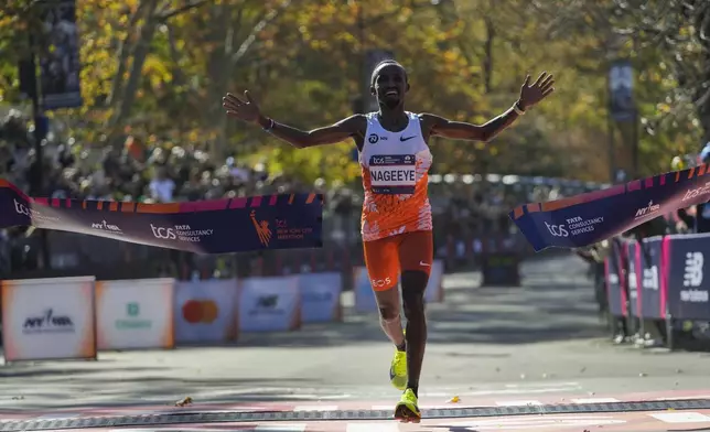 Abdi Nageeye, of the Netherlands, crosses the finish line to win the men's elite division of the New York City Marathon, Sunday, Nov. 3, 2024, in New York. (AP Photo/Frank Franklin II)