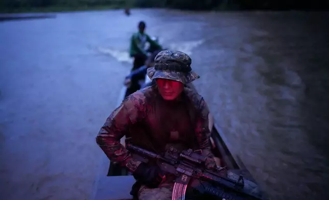 Panamanian border police patrol on the Tuquesa River near Bajo Chiquito, the village in Panama where migrants arrived after crossing the Darién Gap from Colombia en route to the United States, Friday, Nov. 8, 2024. (AP Photo/Matias Delacroix)