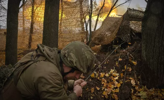 A serviceman of the 13th Brigade of the National Guard of Ukraine fires Giatsint-B gun towards Russian positions near Kharkiv, Ukraine, Wednesday, Nov. 6, 2024. (AP Photo/Efrem Lukatsky)