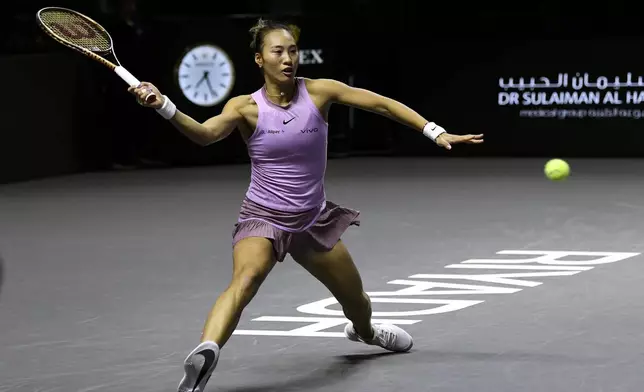 China's Qinwen Zheng plays a shot against Coco Gauff of the U.S. during their women's singles final match of the WTA finals at the King Saud University Indoor Arena, in Riyadh, Saudi Arabia, Saturday, Nov. 9, 2024. (AP Photo)