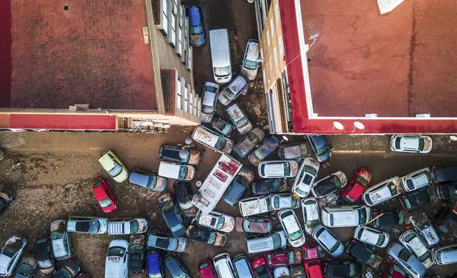 Vehicles pile up in the streets after flooding caused by late Tuesday and early Wednesday storm that left hundreds dead or missing in Alfafar, Valencia region, Spain, Saturday, Nov. 2, 2024.(AP Photo/Angel Garcia)