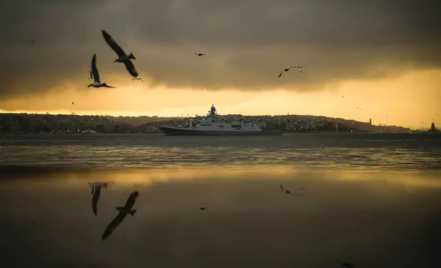 A Turkish military ship patrols the Bosphorus during the 86th anniversary of Turkey's founding father Mustafa Kemal Ataturk's death near Dolmabahce palace in Istanbul, Turkey, Sunday, Nov. 10, 2024. (AP Photo/Emrah Gurel)