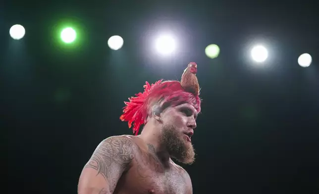 Jake Paul works out ahead of his boxing match against Mike Tyson, Tuesday, Nov. 12, 2024, in Irving, Texas. (AP Photo/Julio Cortez)