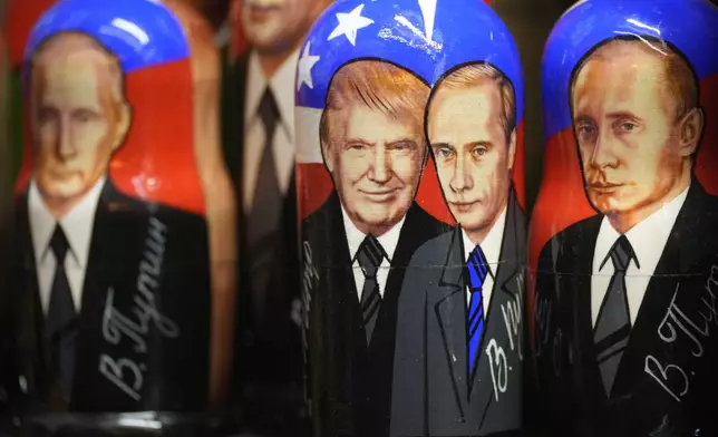 Traditional Russian wooden dolls, called Matryoshka, depicting Republican presidential nominee an former US President Donald Trump, center left, and Russian President Vladimir Putin are displayed for sale at a souvenir shop in St. Petersburg, Russia, Tuesday, Nov. 5, 2024. (AP Photo/Dmitri Lovetsky)