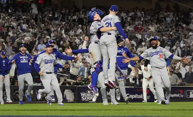 The Los Angeles Dodgers celebrate their win against the New York Yankees in Game 5 to win the baseball World Series, Wednesday, Oct. 30, 2024, in New York. (AP Photo/Godofredo A. Vásquez)