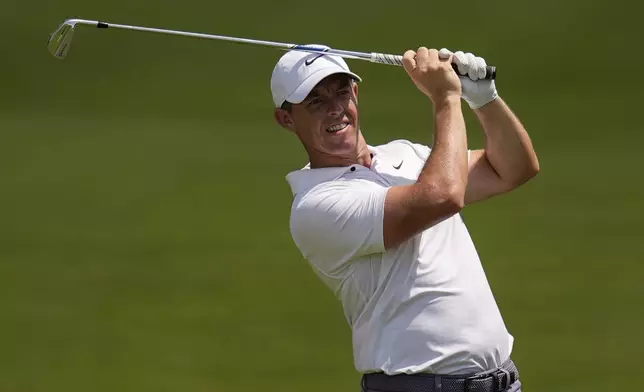 FILE - Rory McIlroy, of Northern Ireland, hits out of the seventh fairway during the second round of the Tour Championship golf tournament, Friday, Aug. 30, 2024, in Atlanta. (AP Photo/Mike Stewart, File)