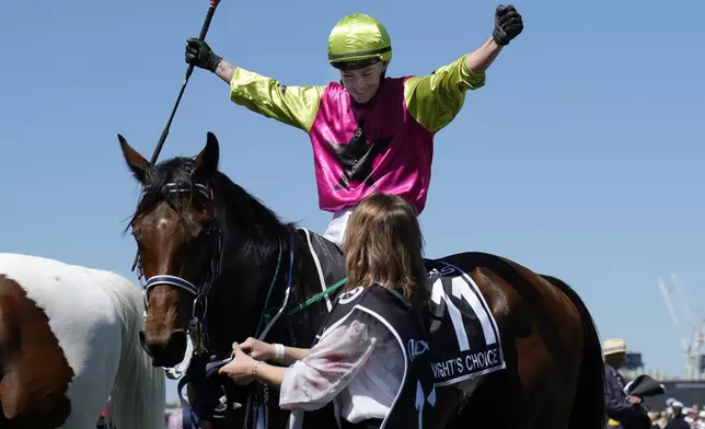 Jockey Robbie Dolan celebrates after riding Knight's Choice to win the Melbourne Cup horse race at Flemington Racecourse in Melbourne, Australia, Tuesday, Nov. 5, 2024. (AP Photo/Asanka Brendon Ratnayake)