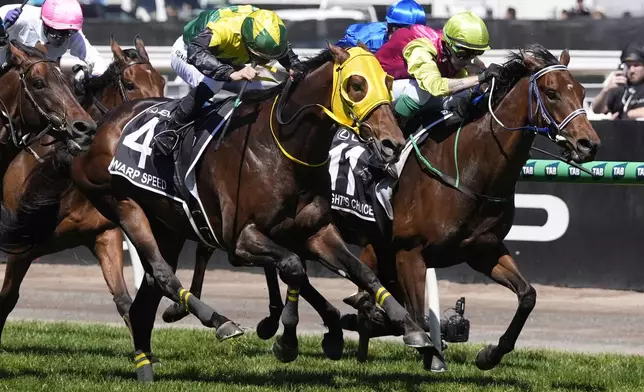 Knight's Choice, right, ridden by Robbie Dolan, races to finish to win the Melbourne Cup horse race at Flemington Racecourse in Melbourne, Australia, Tuesday, Nov. 5, 2024. (AP Photo/Asanka Brendon Ratnayake)