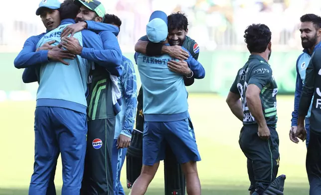 Pakistan's players celebrate after their win in their one day international cricket match against Australia in Perth, Australia, Sunday, Nov. 10, 2024. (AP Photo/Trevor Collens)