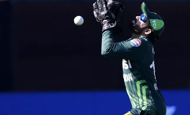 Pakistan's Mohammad Rizwan drops a catch against Australia during their one day international cricket match in Adelaide, Australia, Friday, Nov. 8, 2024. (AP Photo/James Elsby)