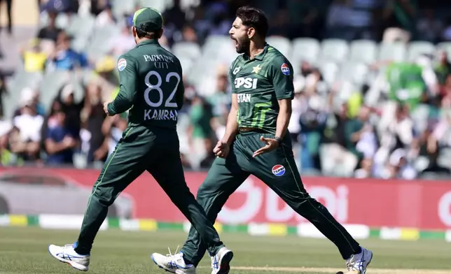 Pakistan's Hasan Ali, right, celebrates the wicket of Australia's Glenn Maxwell during their one day international cricket match in Adelaide, Australia, Friday, Nov. 8, 2024. (AP Photo/James Elsby)