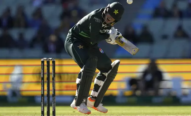 Pakistan's Naseem Shah ducks a bouncer from Australia's Mitchell Starc during their one day international cricket match in Melbourne, Monday, Nov. 4, 2024. (AP Photo/Asanka Brendon Ratnayake)