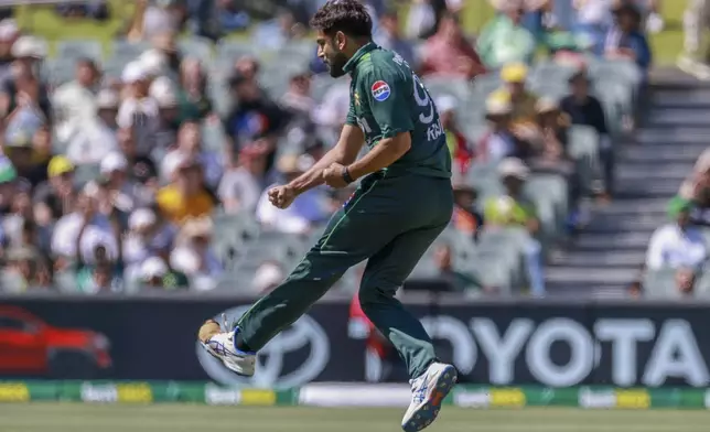 Pakistan's Haris Rauf jumps in air as he celebrates the dismissal of Australia's Josh Inglis during the second one day international cricket match between Australia and Pakistan in Adelaide, Friday, Nov. 8, 2024. (AP Photo/James Elsby)