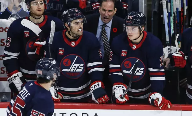 Winnipeg Jets head coach Scott Arniel talks to his team during the third period of an NHL hockey game against the Colorado Avalanche, Thursday, Nov. 7, 2024 in Winnipeg, Manitoba. (John Woods/The Canadian Press via AP)