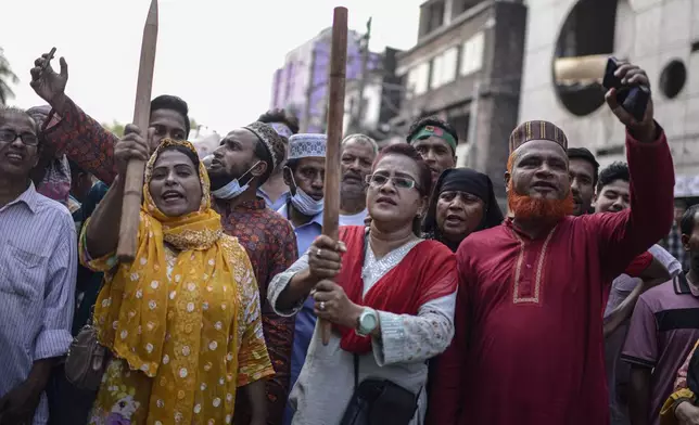 Bangladesh Nationalist Party activists shout slogans during a protest to counter former prime minister Sheikh Hassan's Awami League party rally in Dhaka, Bangladesh, Sunday, Nov. 10, 2024. (AP Photo/Mahmud Hossain Opu)